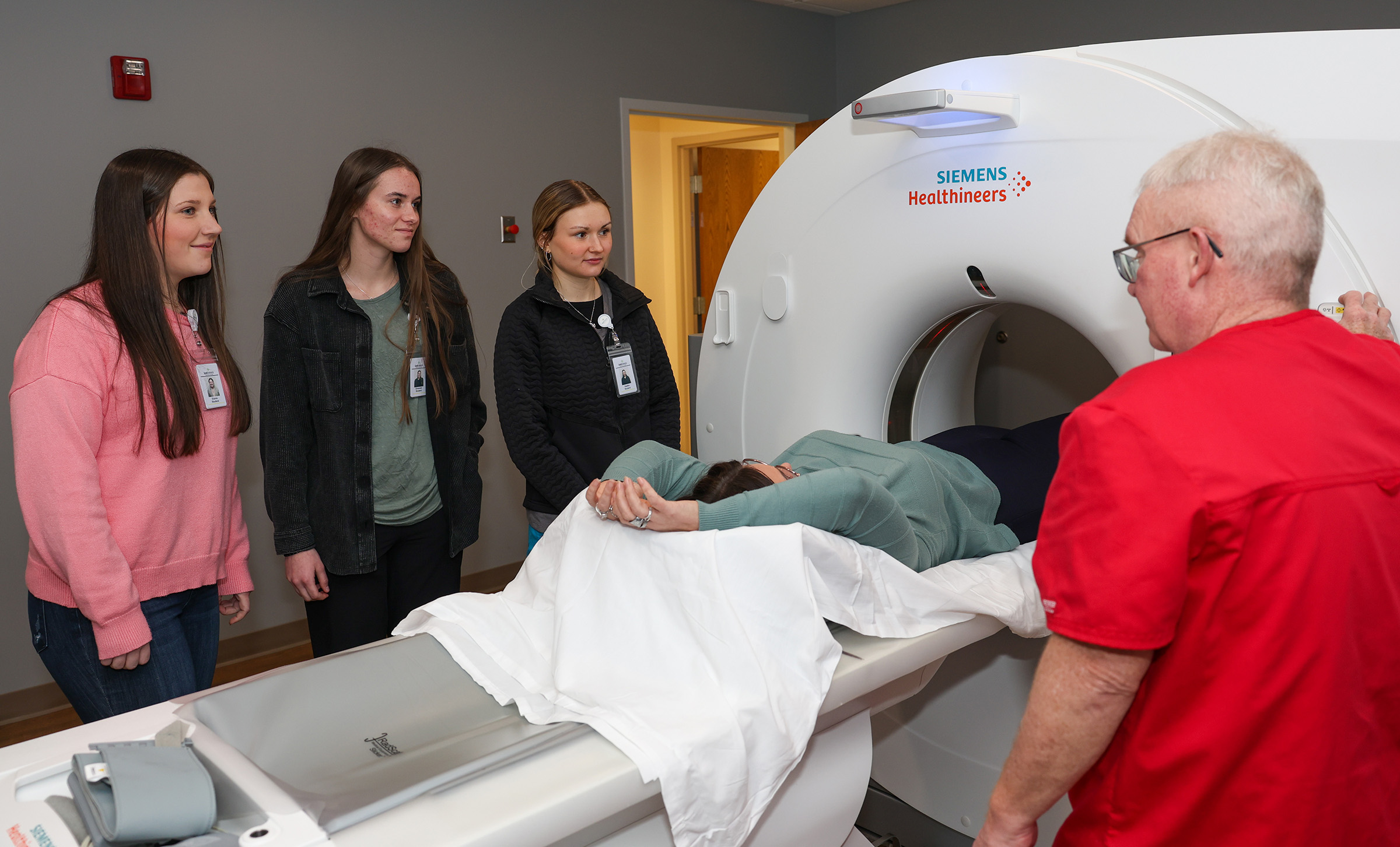 From left, UNK health science students Eliana Livingston, Genesee Knackstedt and Katie Cook visit the radiology department at Cozad Community Health System while participating in the Rural Immersion Program.