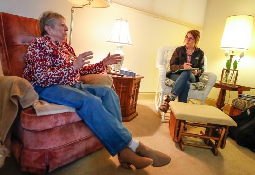 UNK social work student Julia Daro discusses end-of-life plans with Cambridge Court resident Judith Middleton. Daro and other UNK students meet one-on-one and conduct psychosocial assessments of elderly residents. (Photo by Corbey R. Dorsey, UNK Communicatio