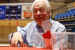 Paul Younes of Kearney reacts to his poker hand at Thursday’s Red Dress Poker Tournament. Younes was among more than 150 people playing in the University of Nebraska at Kearney event, which raised about $9,000 for women’s heart health. (Photo by Corbey R. Dorsey, UNK Communications)