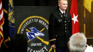 UNK graduate Cannon Marchand participates in an ROTC commissioning ceremony Friday in the Nebraskan Student Union Antelope Room. Marchand, who received the rank of second lieutenant in the Nebraska Army National Guard, will serve with the 195th Forward Support Company in Omaha. (Photo by Tyler Ellyson, UNK Communications)
