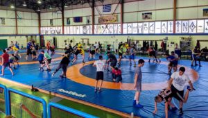 The UNK wrestling team trains with Atlas Kallitheas, the top wrestling club in Athens, during last month’s trip to Greece. (Courtesy photo)