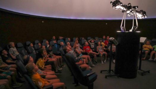 Elementary students learn about the solar system Monday during a presentation in the UNK planetarium. The activity was part of Early Awareness Day, an annual event that brought 73 area fourth graders to campus. (Photo by Corbey R. Dorsey, UNK Communications)