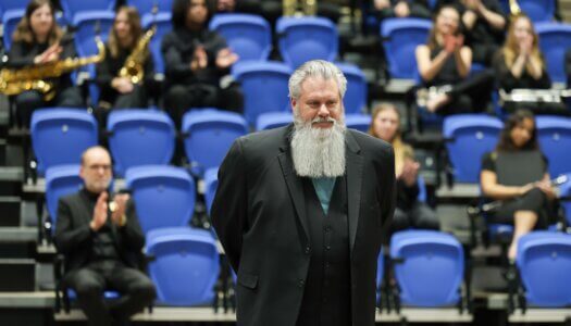 A musical conductor is introduced at a concert at UNK.