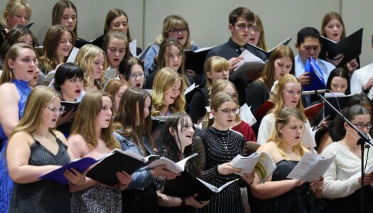 High school students sing at a choral concert at UNK.