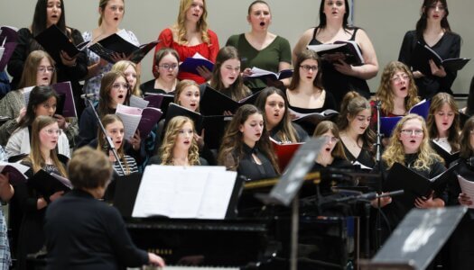 High school students sing at a choral concert at UNK.