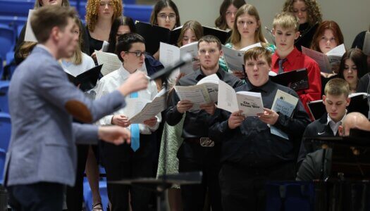 High school students sing at a choral concert at UNK.