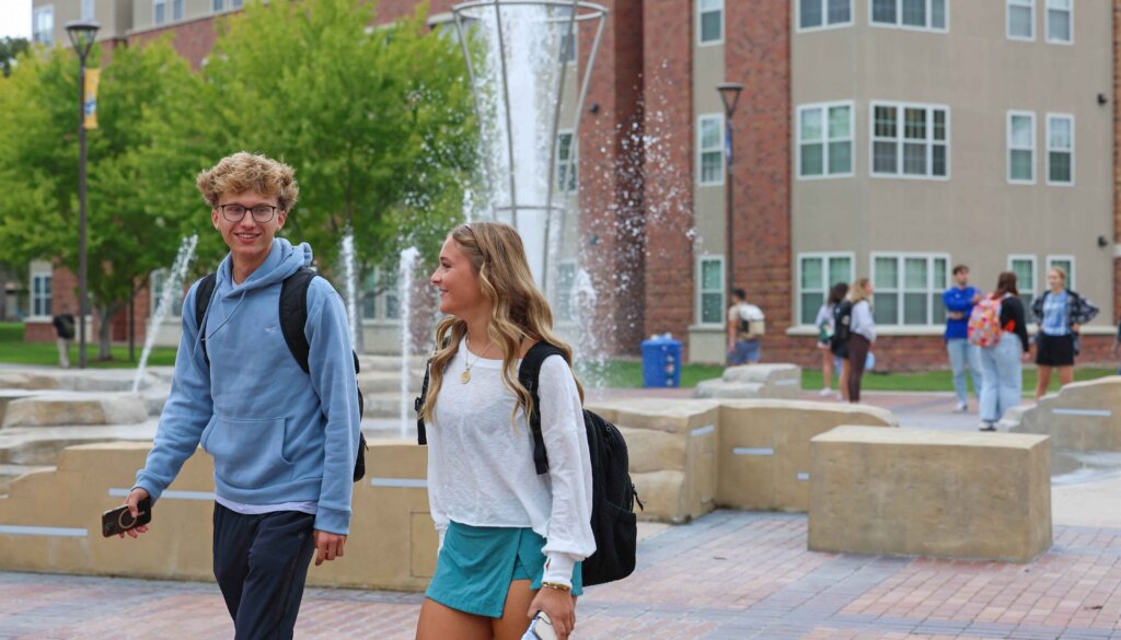 Photo of two students walking near Cope Fountain