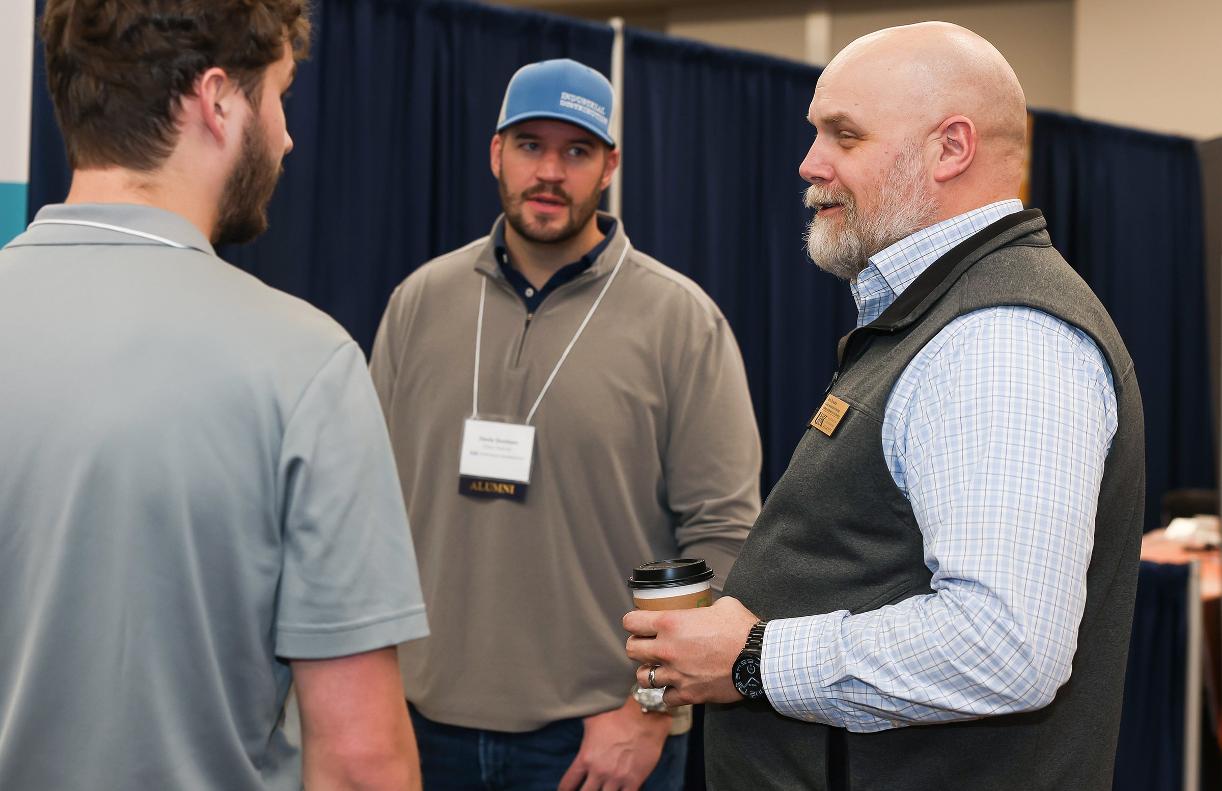 Ben Brachle chats with employers during an industrial distribution career fair.