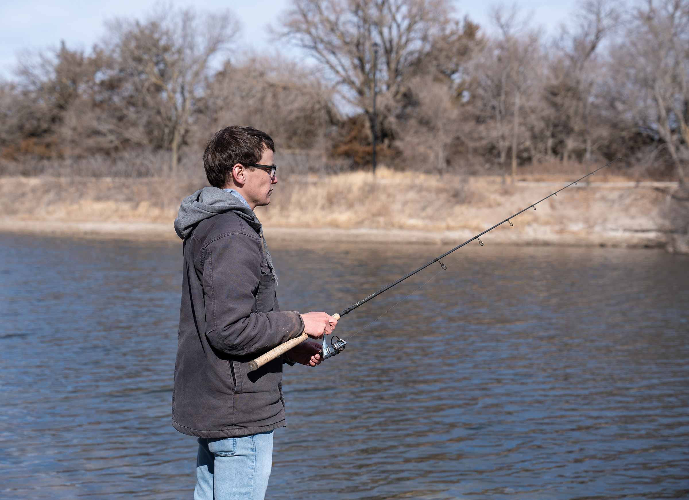 Connor Banzhaf fishes at Archway Lake in Kearney.