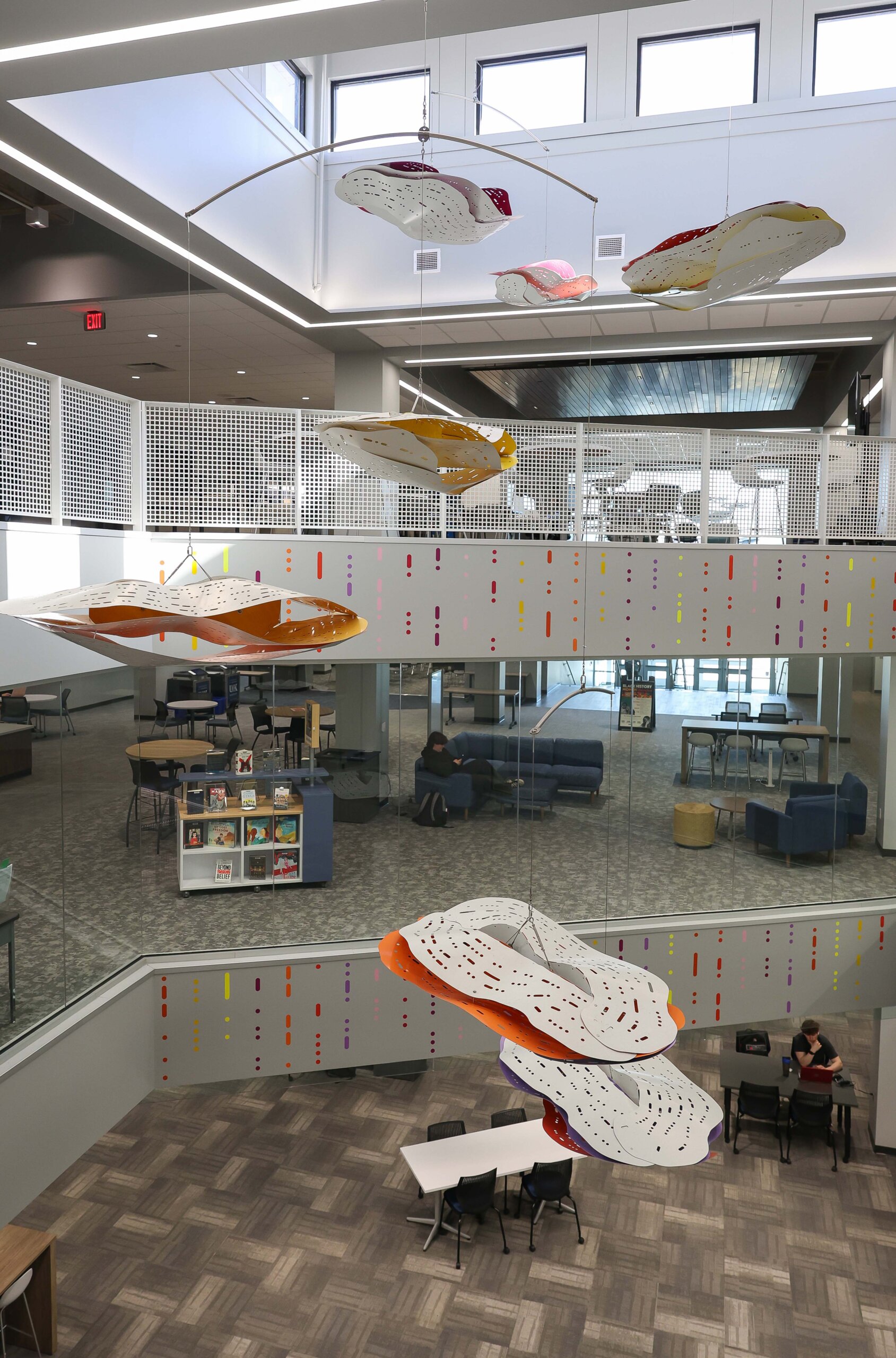 Artwork is hung in the atrium of the library.