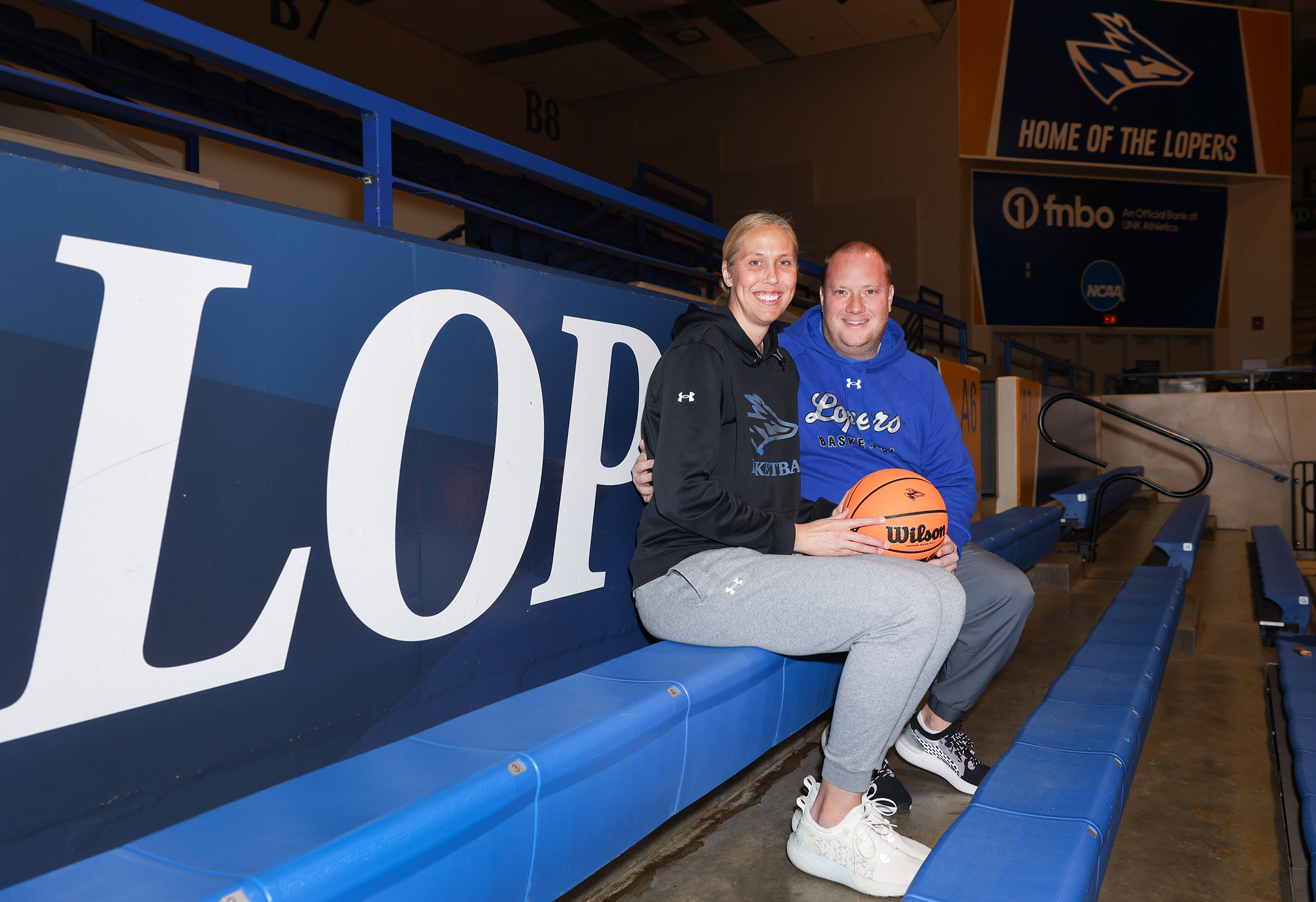 Drew and Nicole Johnson pose for a photo inside UNK's Health and Sports Center.
