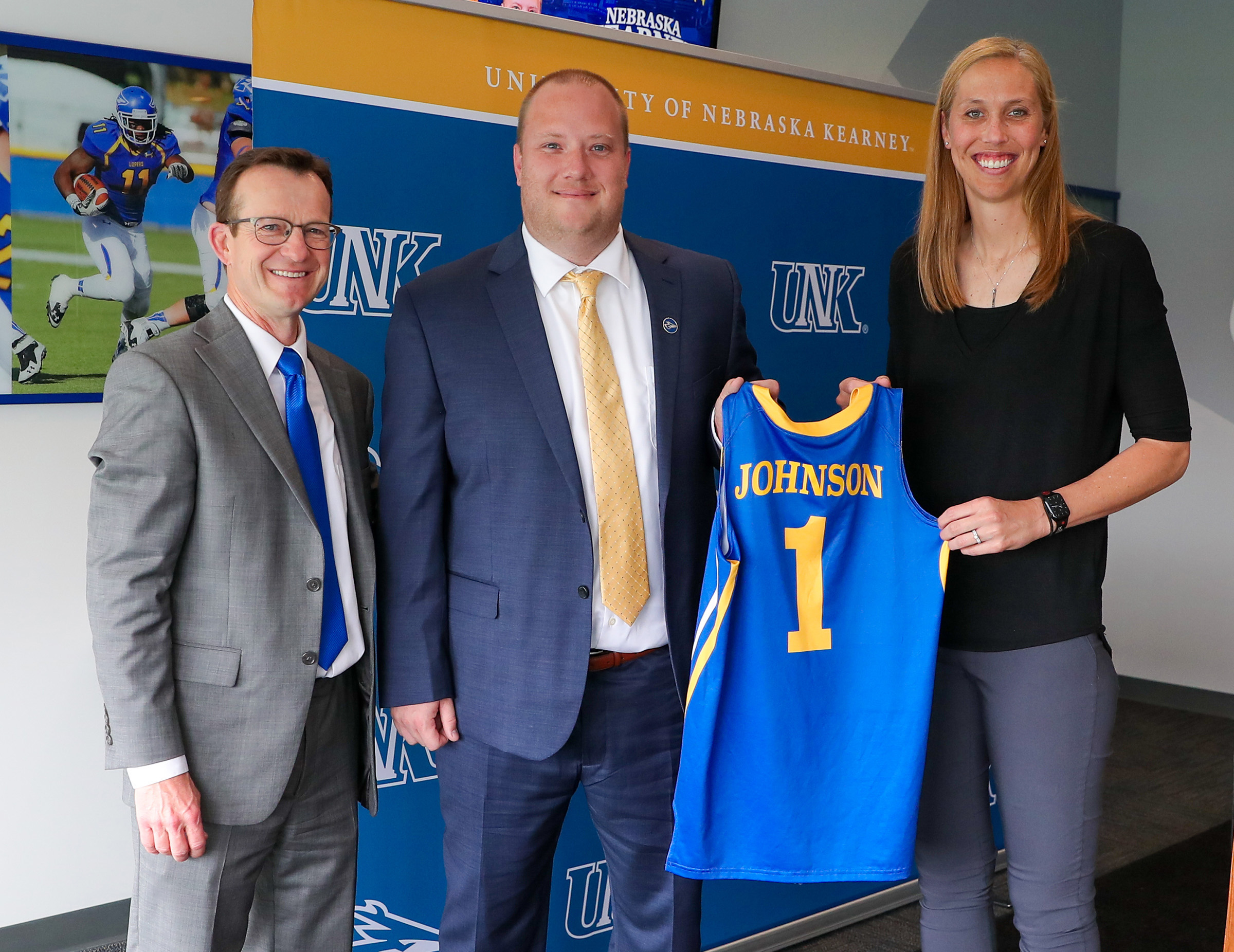 UNK women’s basketball coaches Drew and Nicole Johnson are pictured with Athletic Director Marc Bauer, left, during an introductory press conference in May 2023.