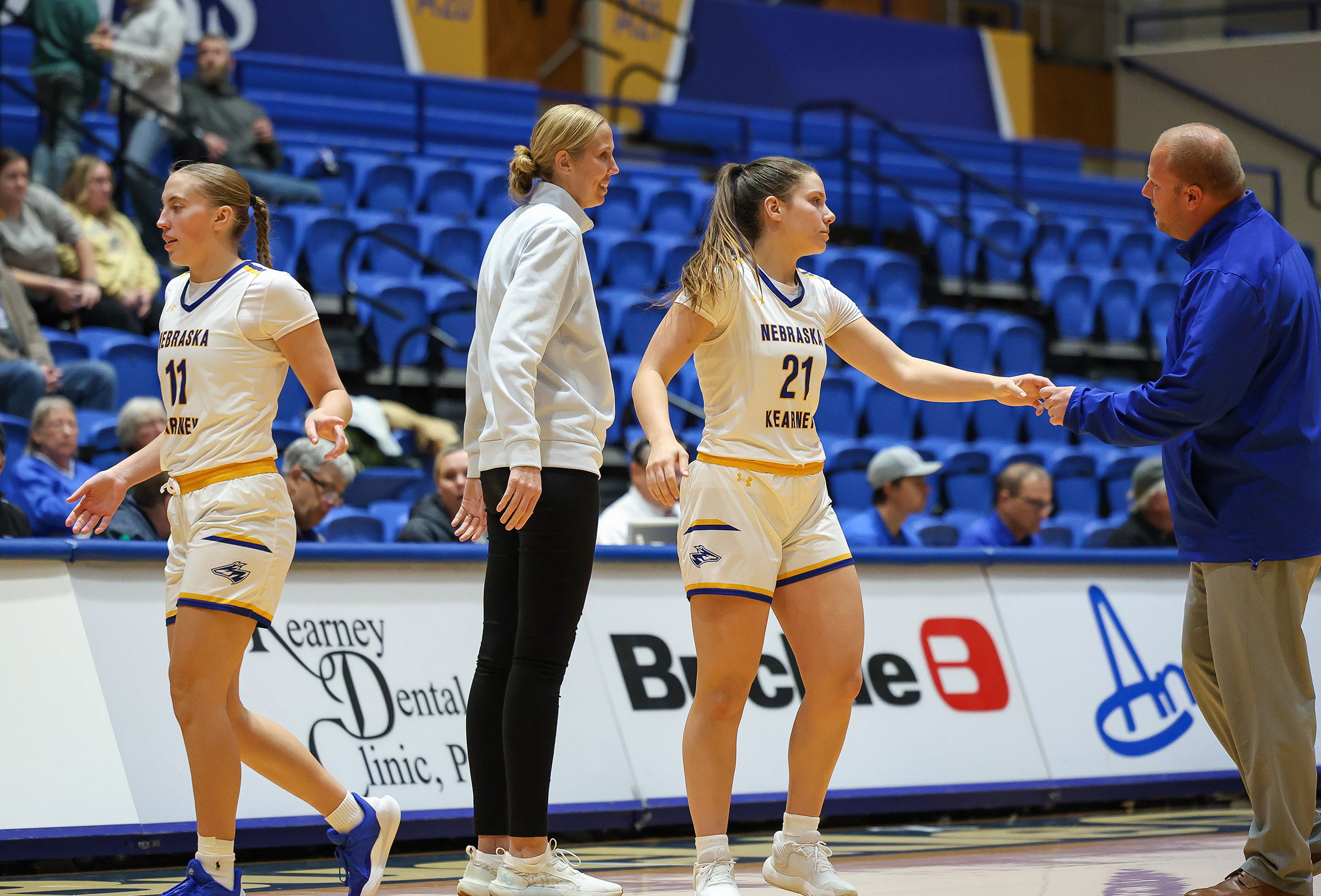 Drew and Nicole Johnson coach their players during a game at UNK's Health and Sports Center.