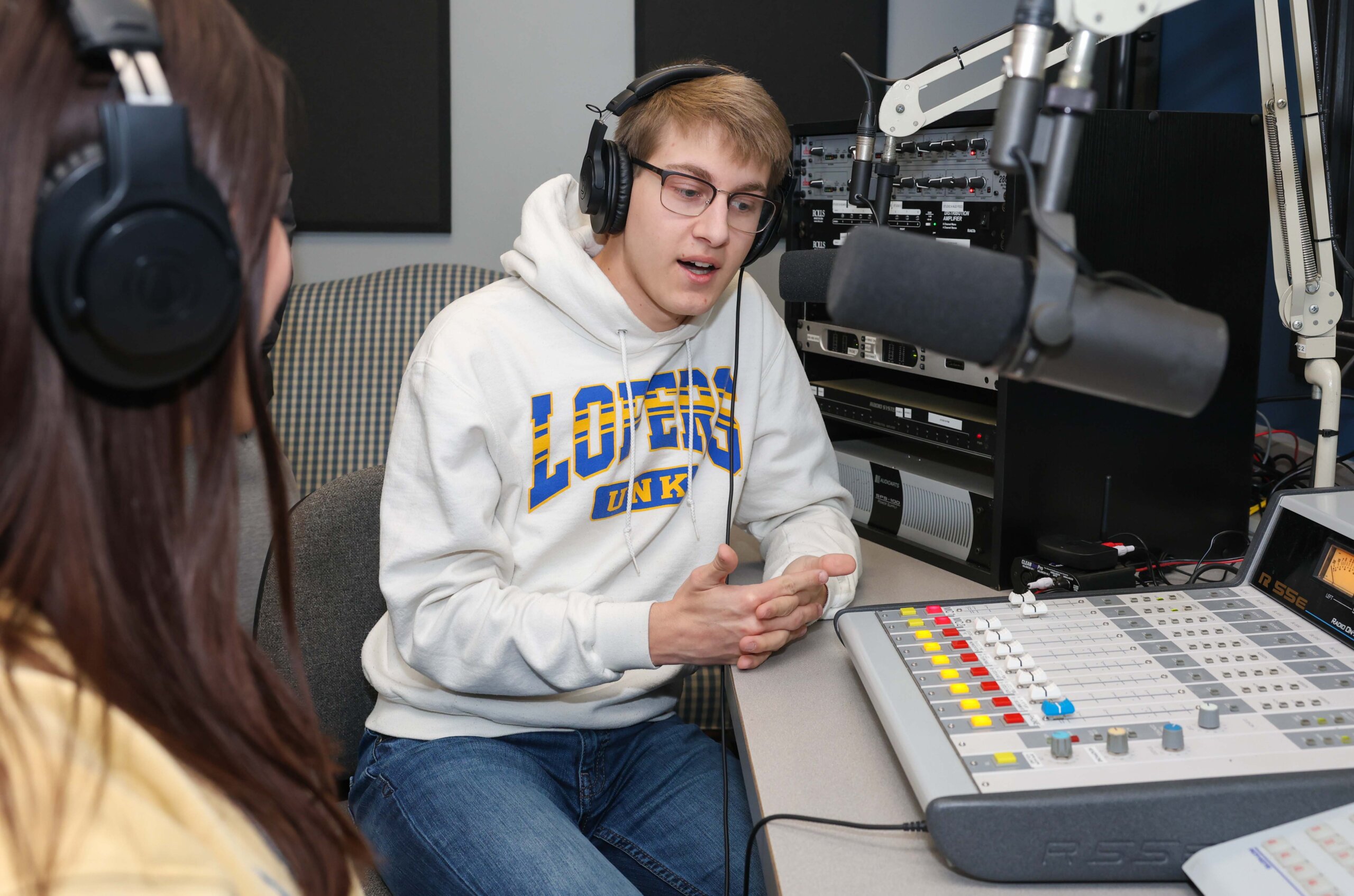 Students practice at the campus radio station.