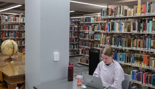 A student studies in the library.