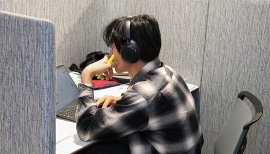 A student studies in a pod in the library.