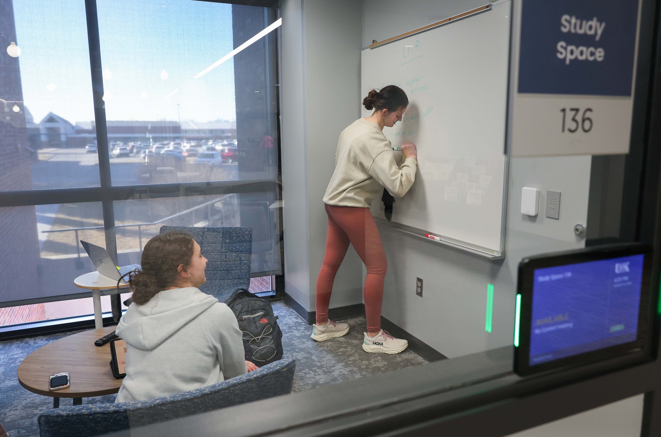 Students study in a study space in the library.