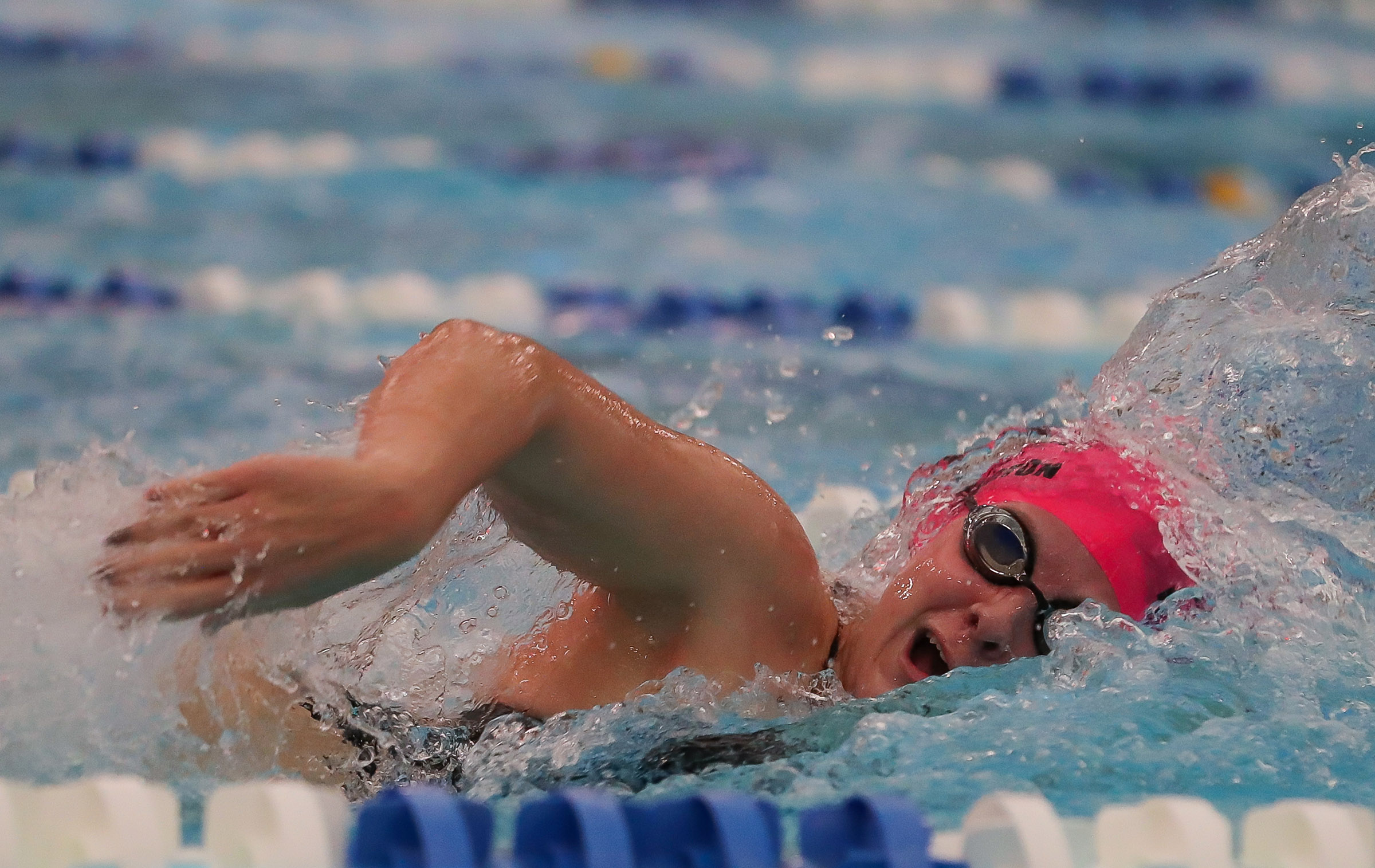 Maggie Waddington competes in a medley relay.