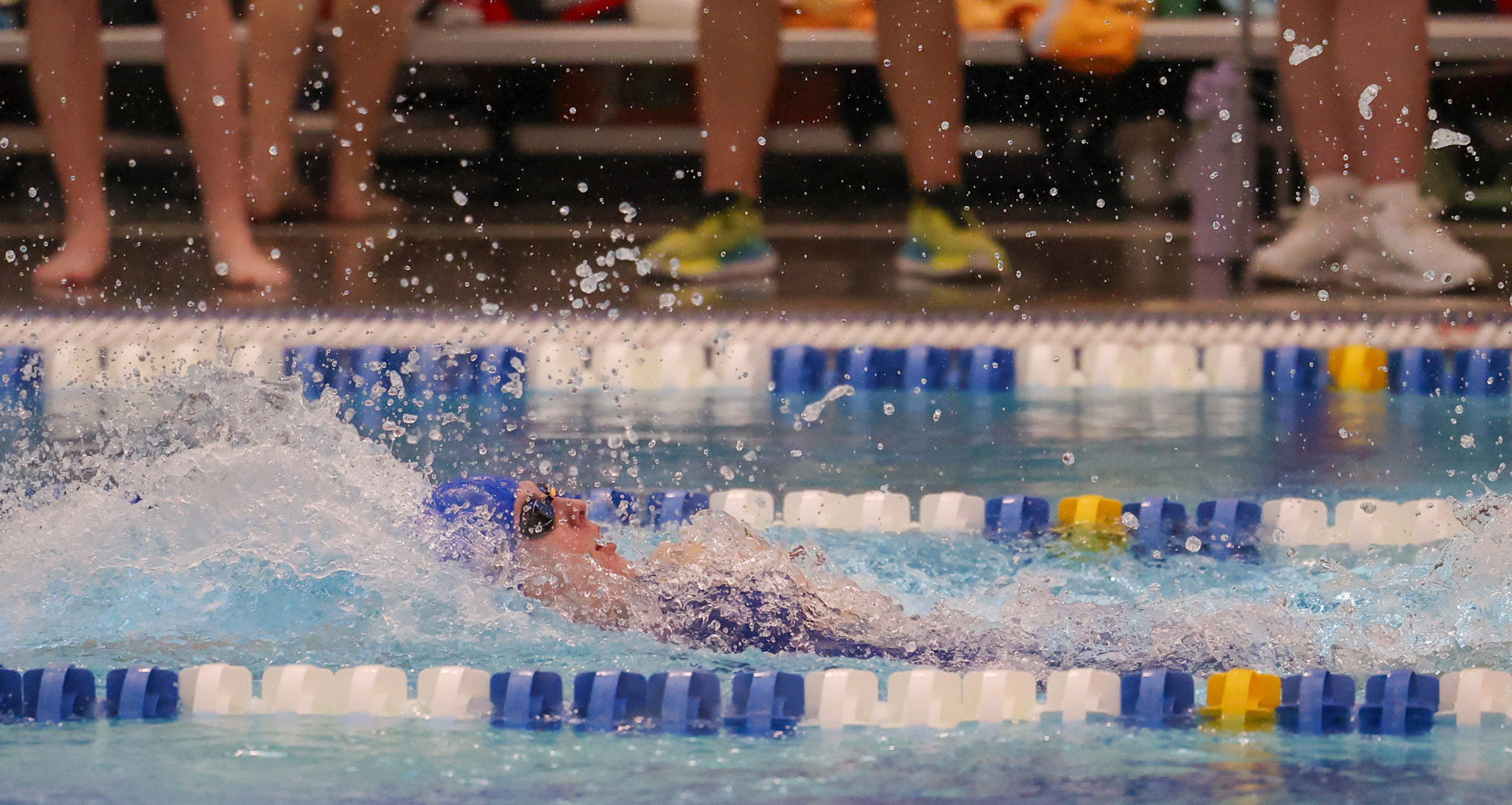 Maggie Waddington competes in a medley relay.