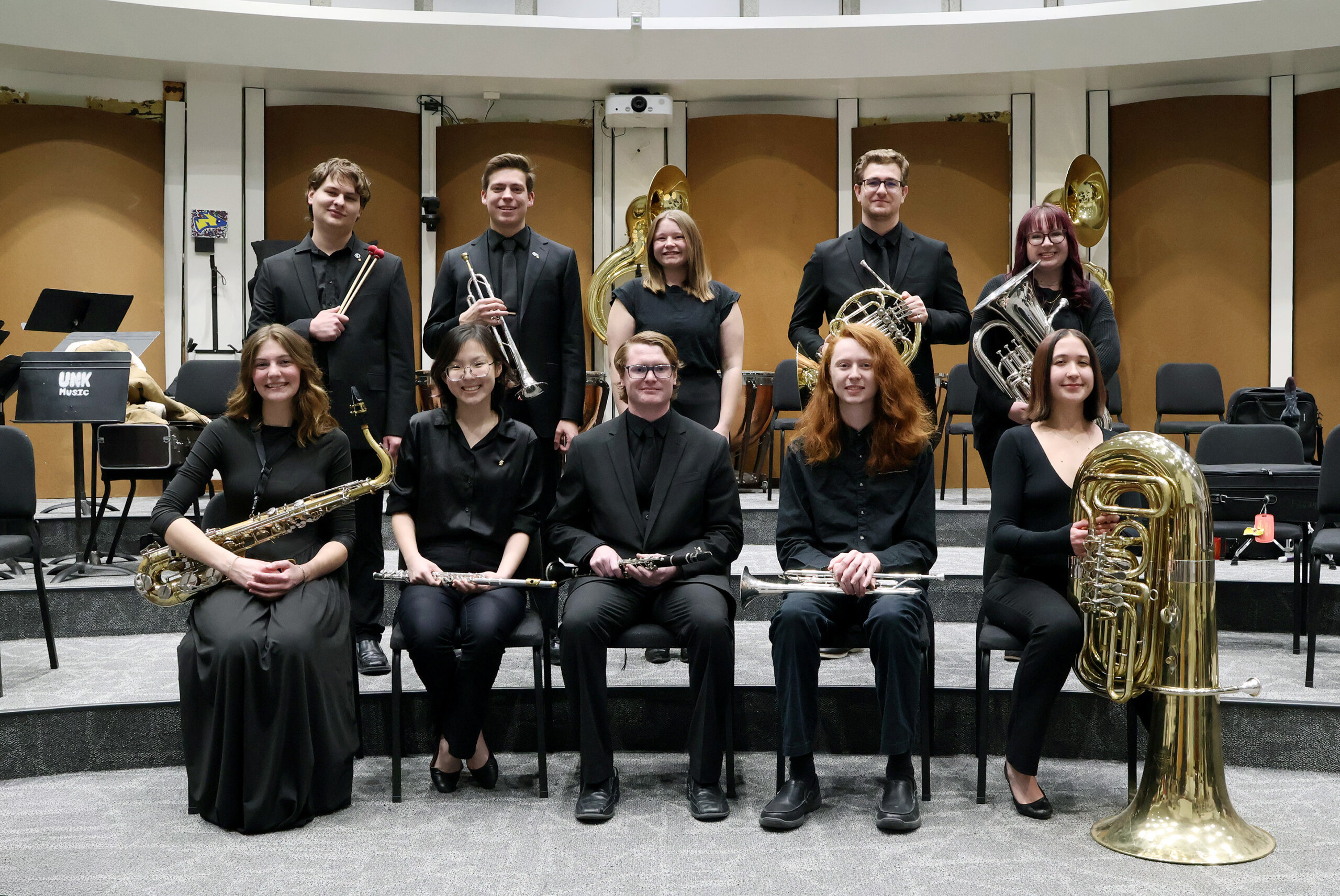 Nebraska Intercollegiate Band members pose for a photo inside a music room on the UNK campus.
