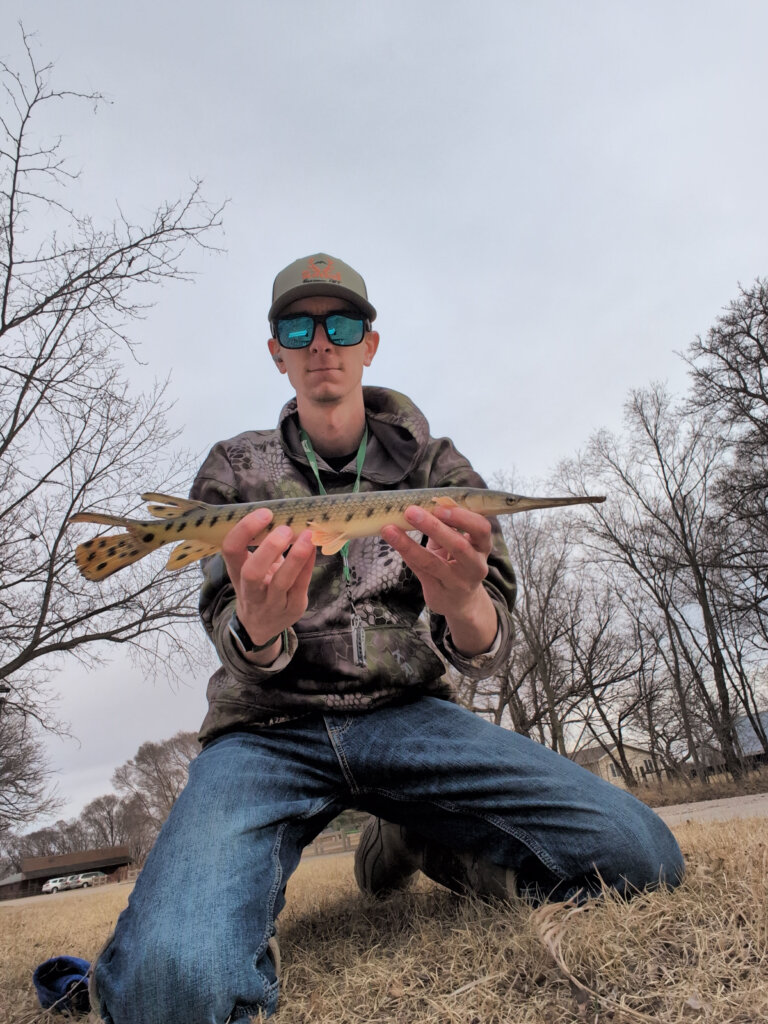 Robert Allison holds a gar.