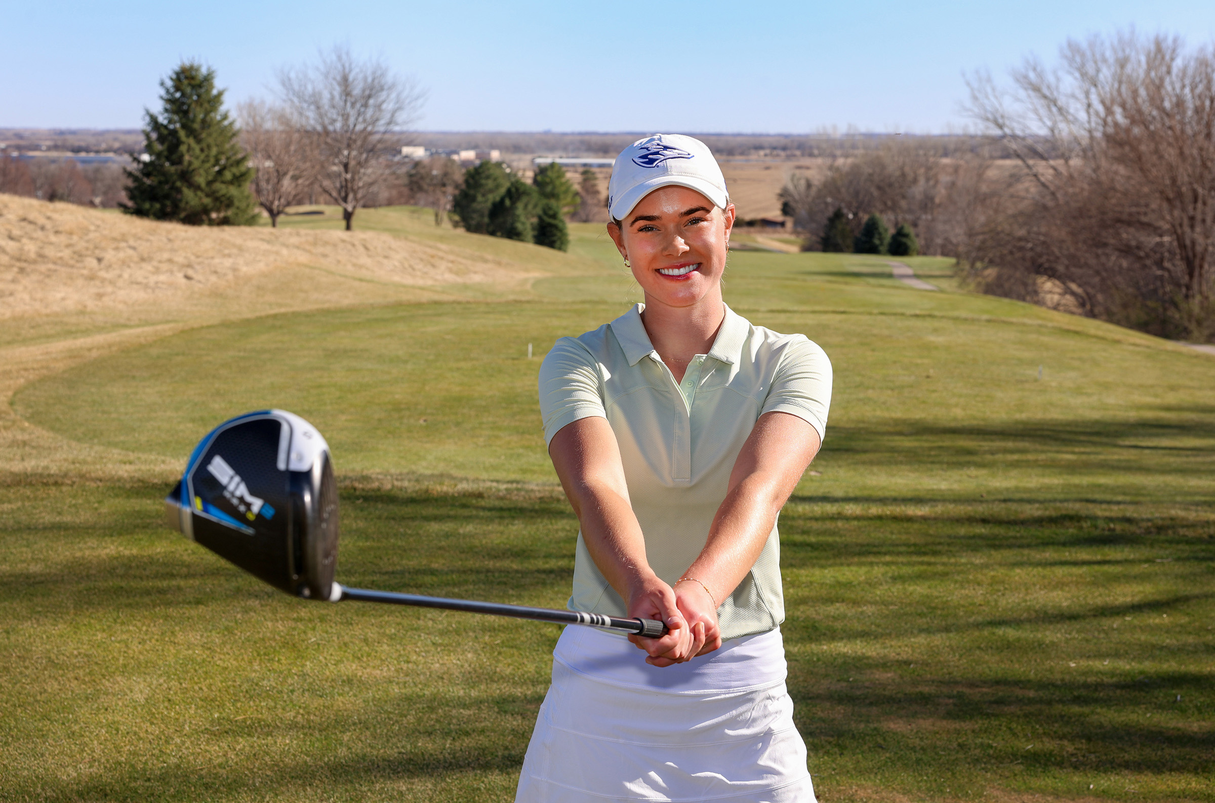 Calie Dockter poses for a photo at Meadowlark Hills Golf Course in Kearney.