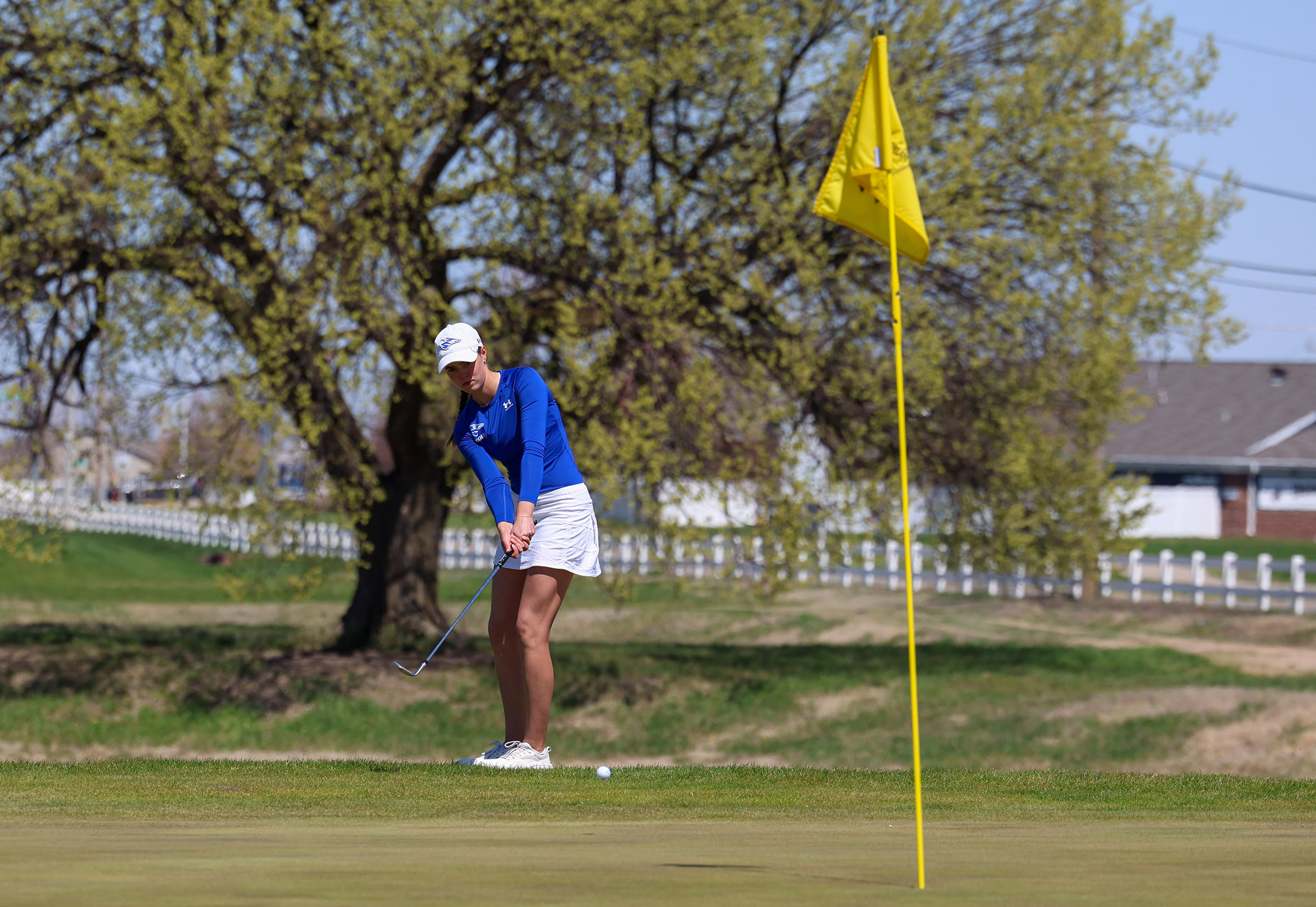 Calie Dockter chips onto the green at Meadowlark Hills Golf Course.
