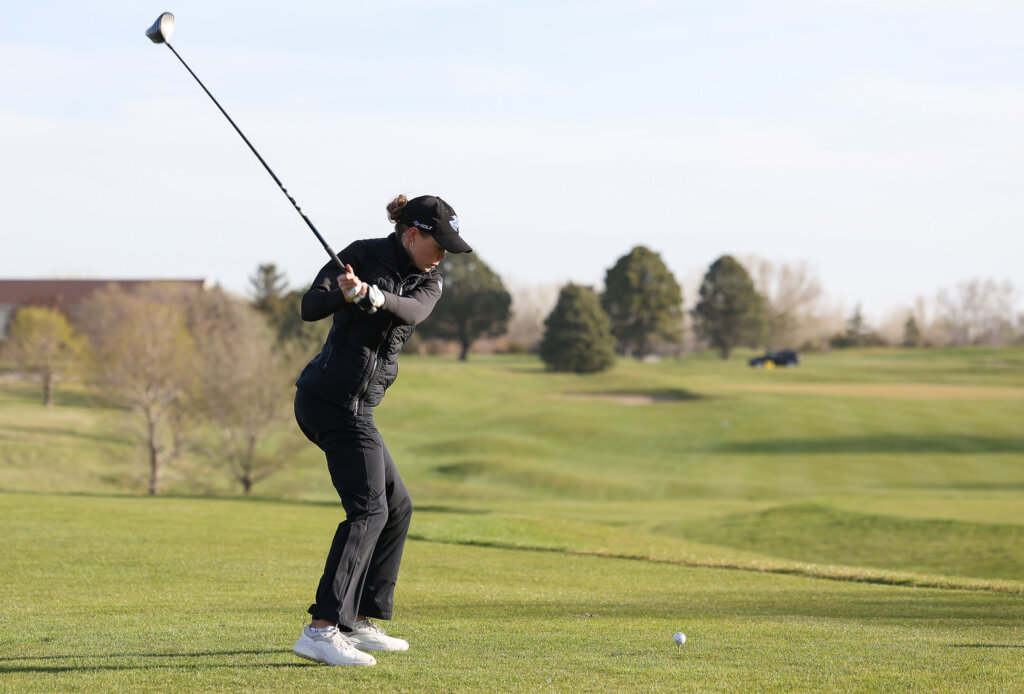 Calie Dockter hits a tee shot during the MIAA Championships at Meadowlark Hills Golf Course.