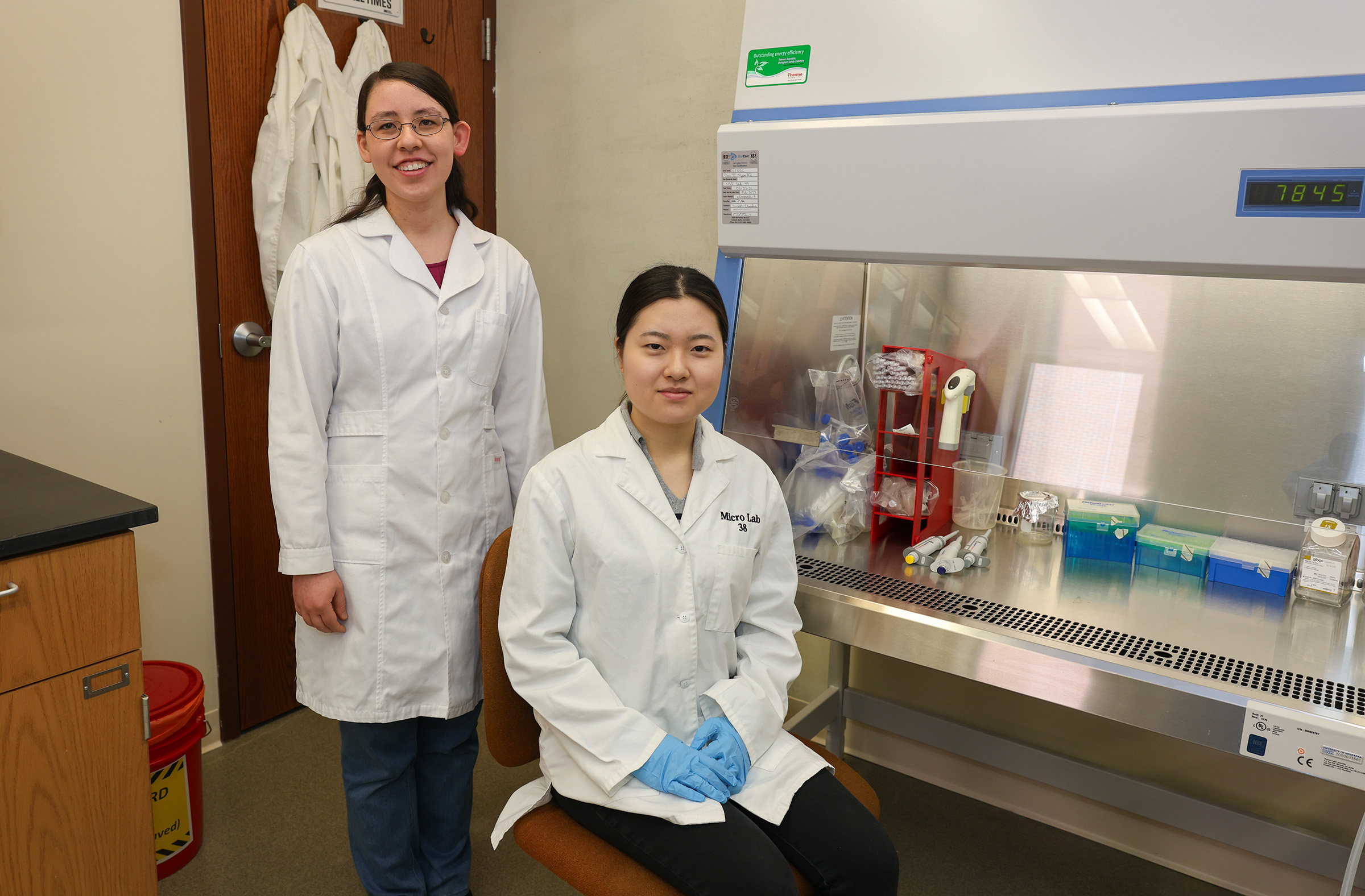UNK assistant biology professor Catherine Johnson, left, and junior Eri Watanabe pose for a photo in Johnson’s lab.