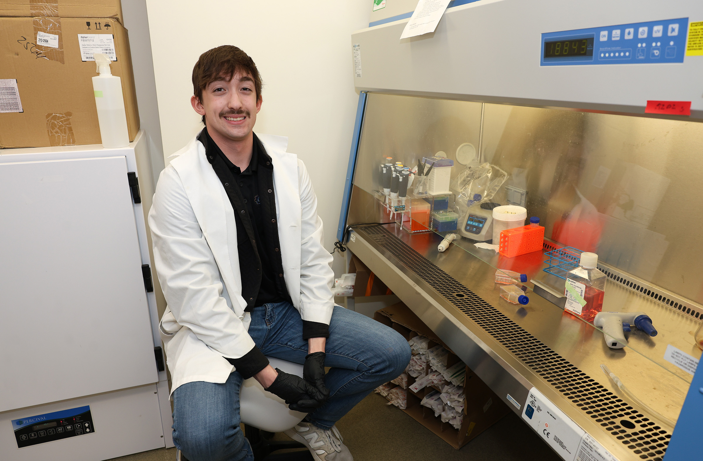Carter Moss is pictured inside a research lab at UNK.