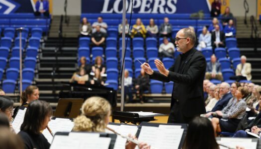 Duane Bierman leads the UNK Wind Ensemble.