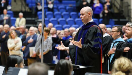 UNK Chancellor Neal Schnoor leads the Wind Ensemble.
