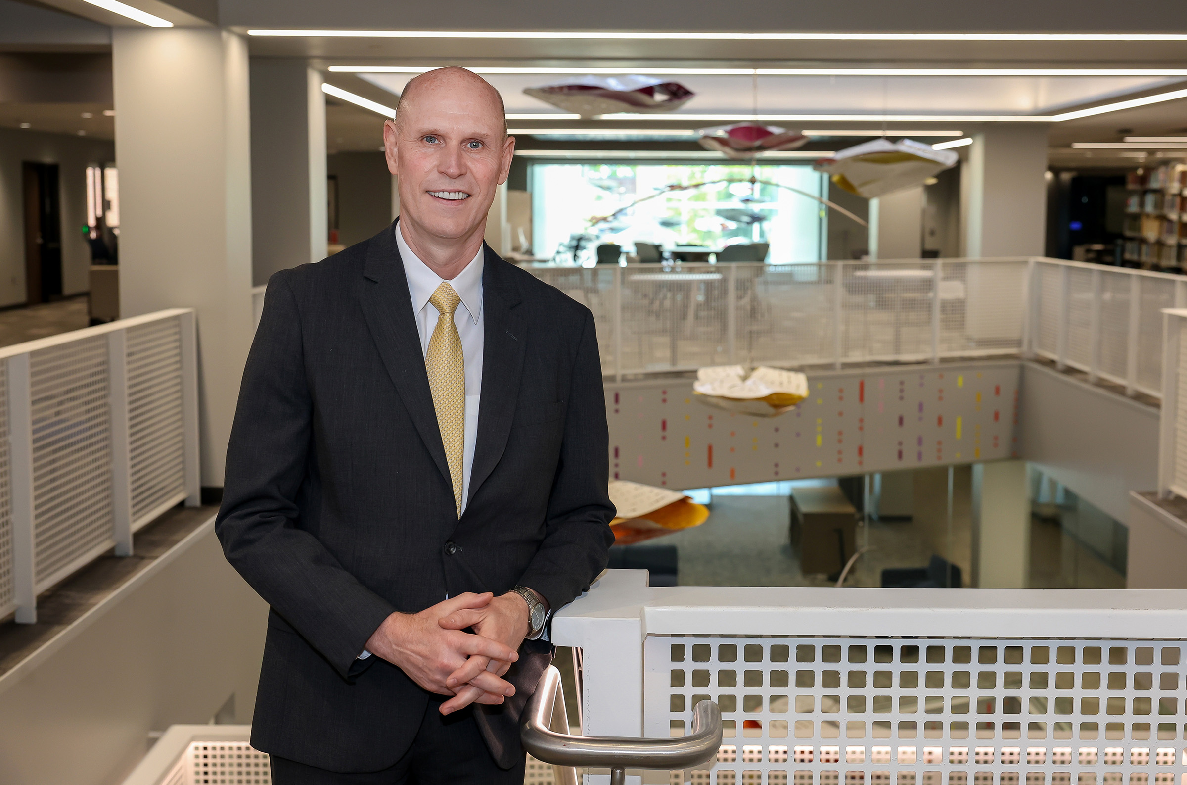 UNK Chancellor Neal Schnoor poses for a photo in the campus library.