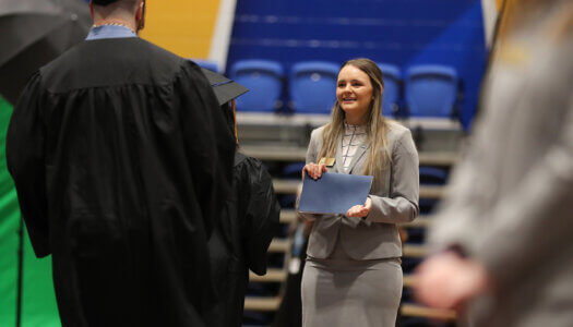 Former Chancellor's Ambassador Jessie Daake is pictured during a UNK commencement ceremony.