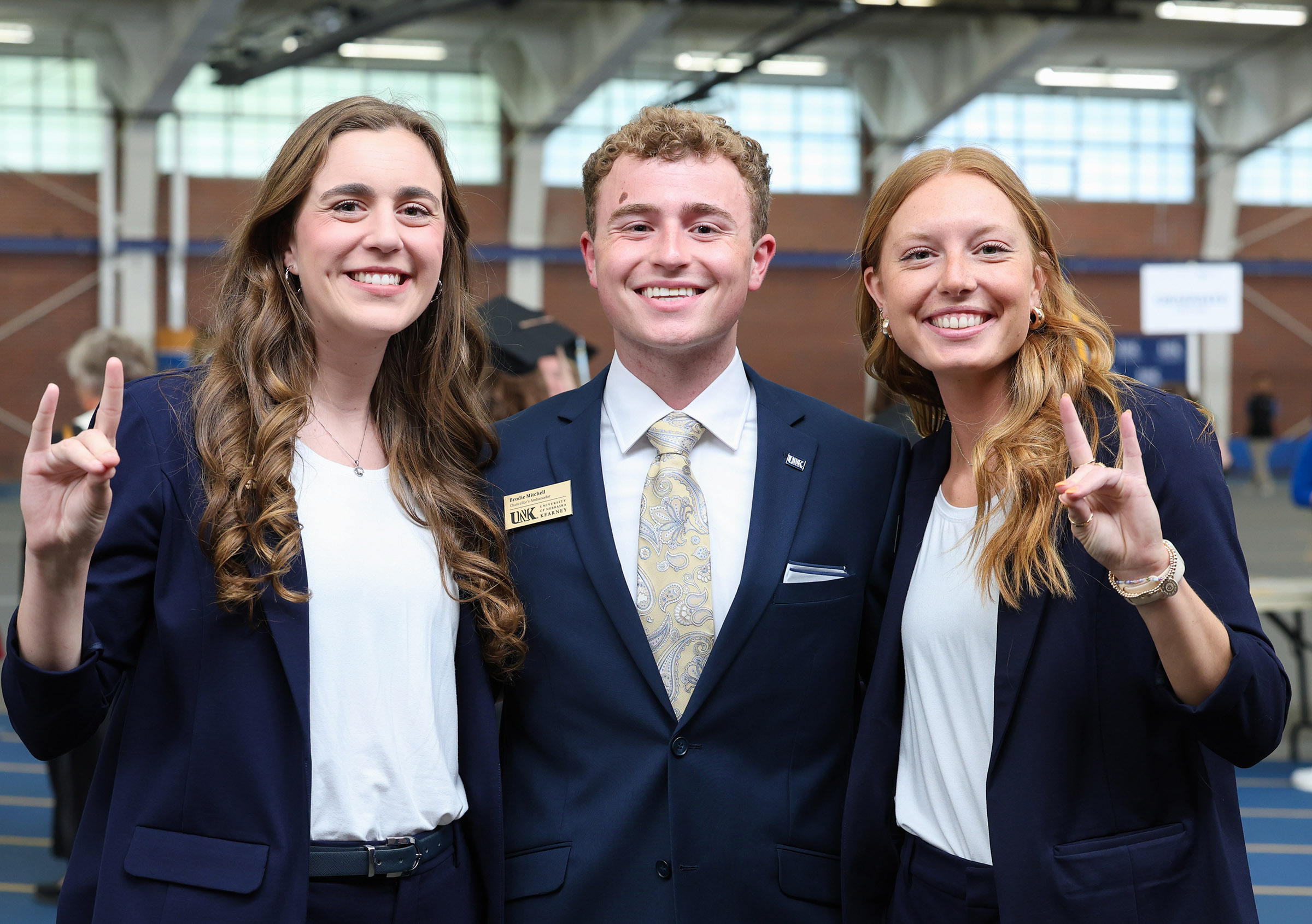 Chancellor’s Ambassadors Emma Nolan, Brodie Mitchell and Jenna Rauert pose for a photo during commencement.