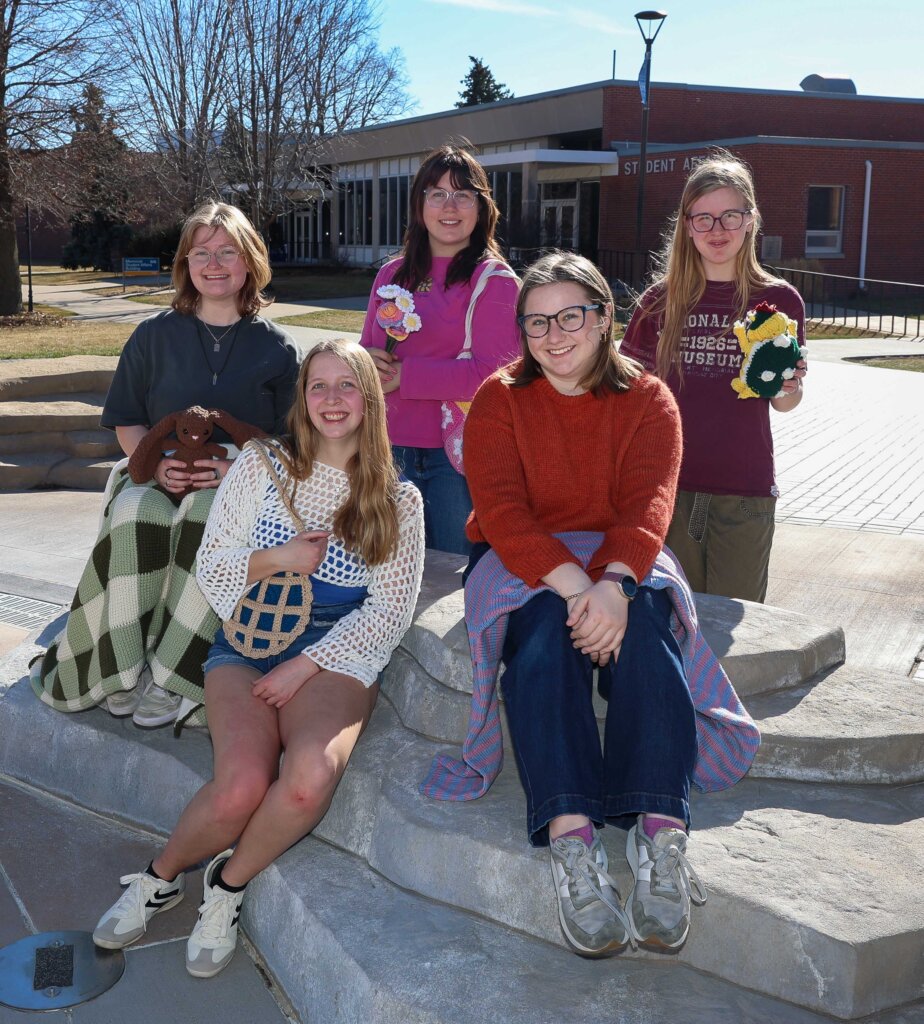 Crochet Circle members are pictured with some of the items they've created.