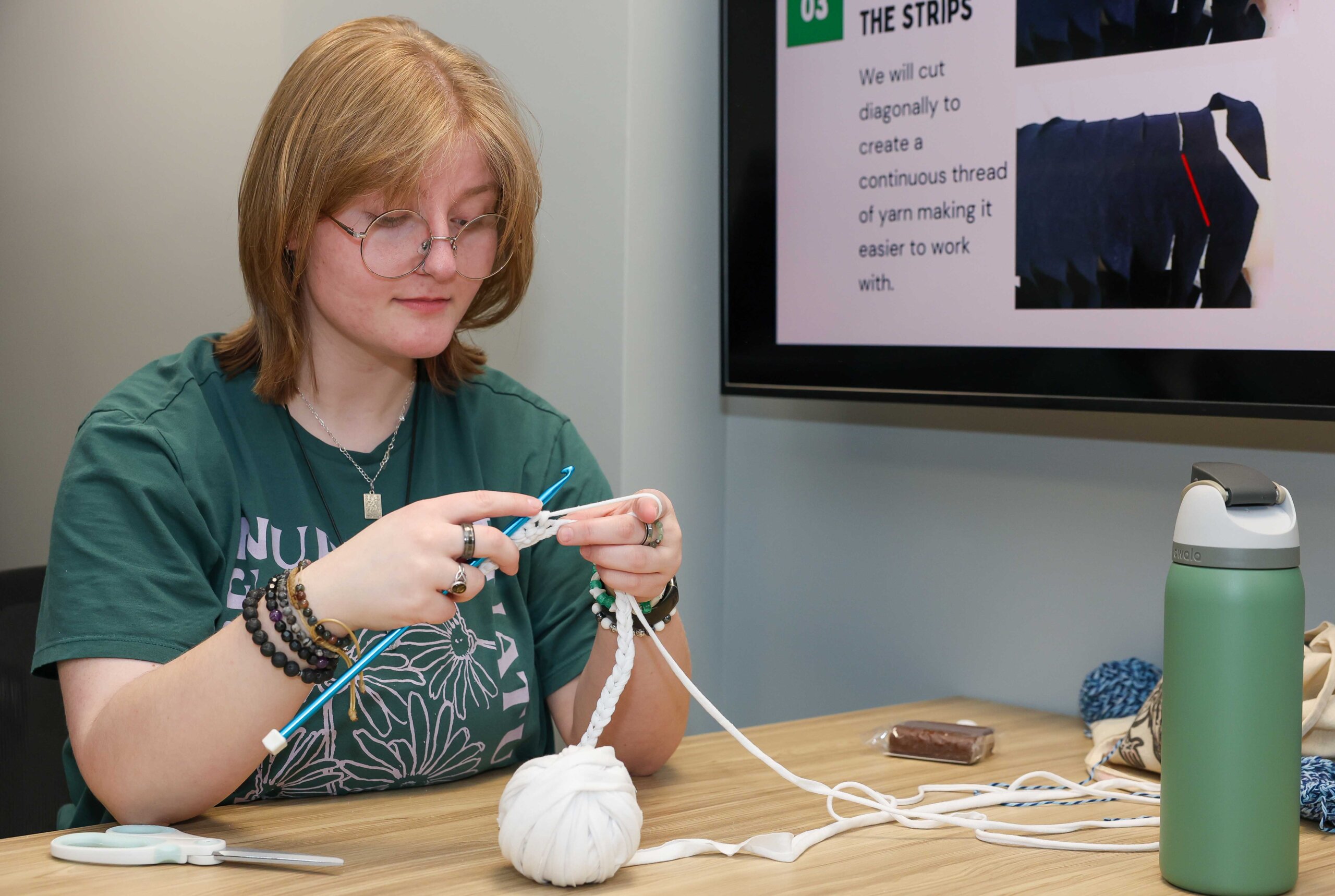 UNK junior Gabby Klein works on a project during a recent Crochet Circle meeting. 