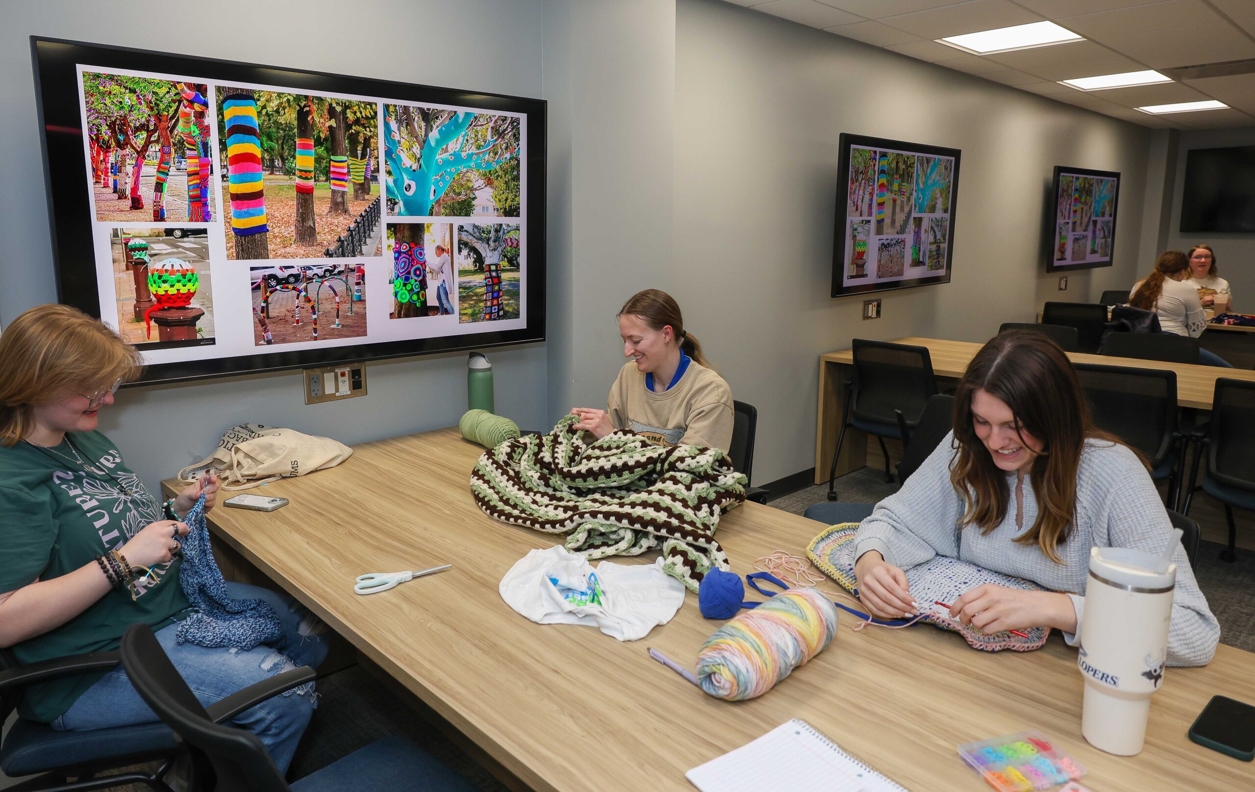 Crochet Circle members work on projects during a recent meeting.