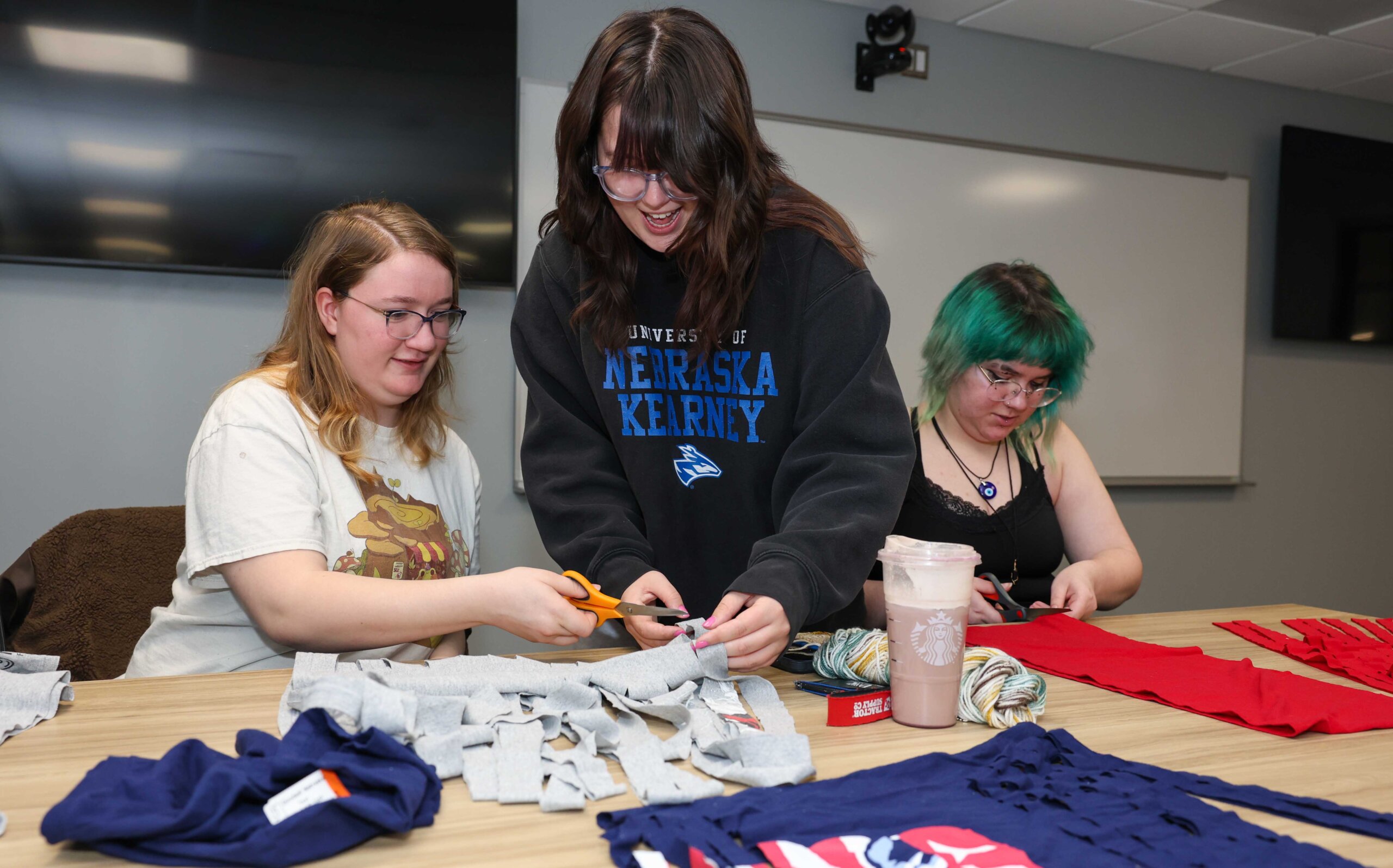 UNK junior Julia McKlem leads an activity during a recent Crochet Circle meeting.