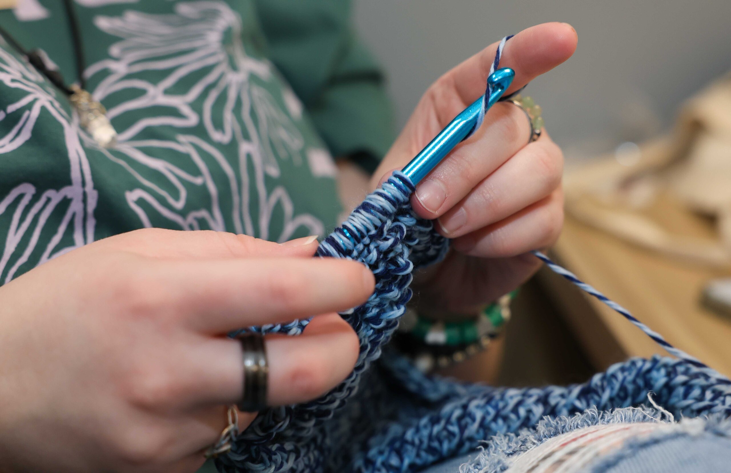 Closeup photo of a student crocheting.