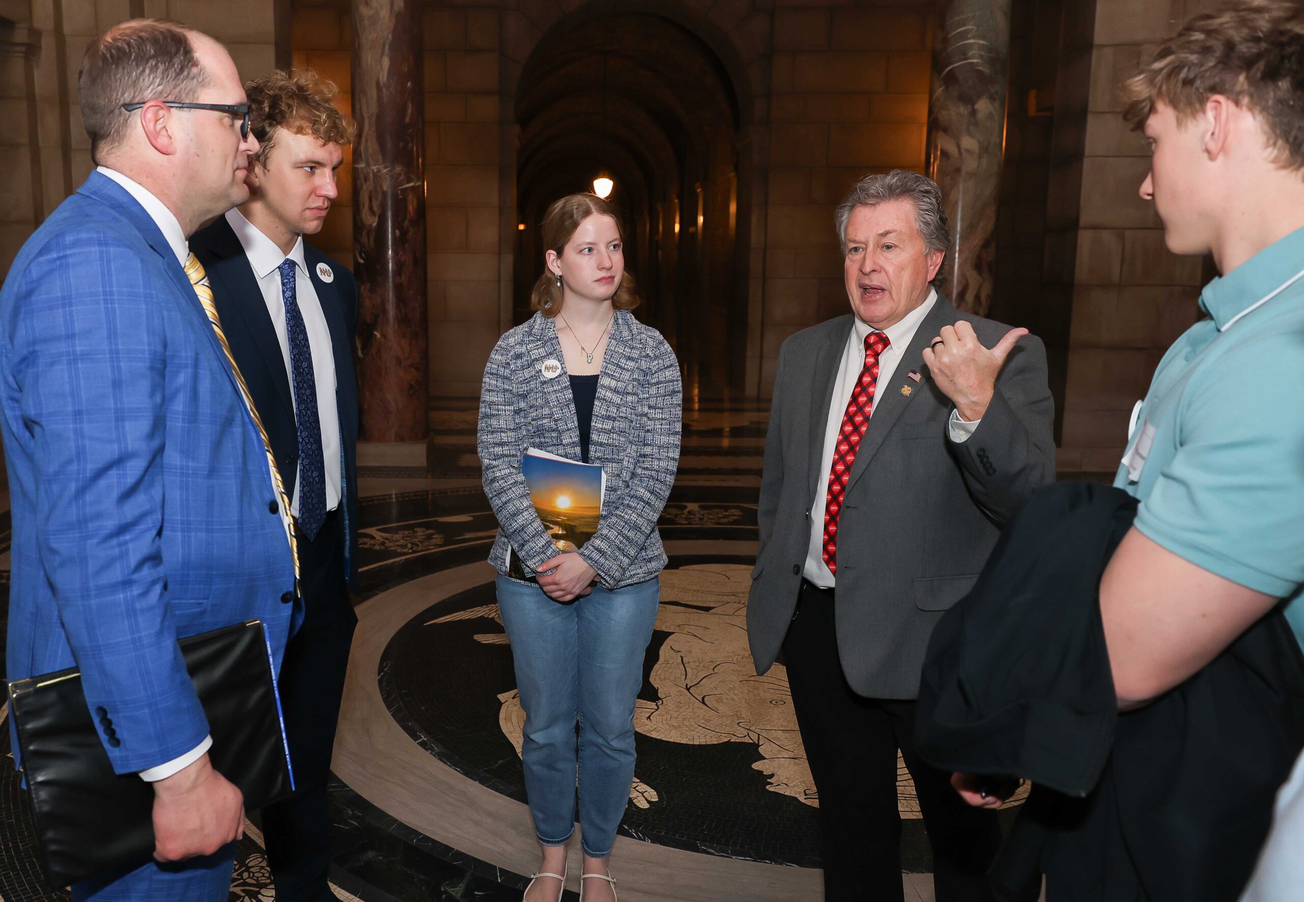 Sen. Stan Clouse of Kearney meets with UNK students in the State Capitol Rotunda.