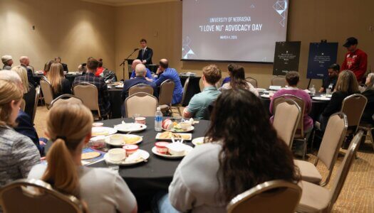 UNK senior Sam Schroeder addresses the audience during "I Love NU" Day.