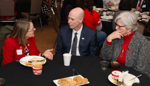 UNK Chancellor Neal Schnoor and UNL interim Chancellor Katherine Ankerson visit with state Sen. Jane Raybould during "I Love NU" Day.