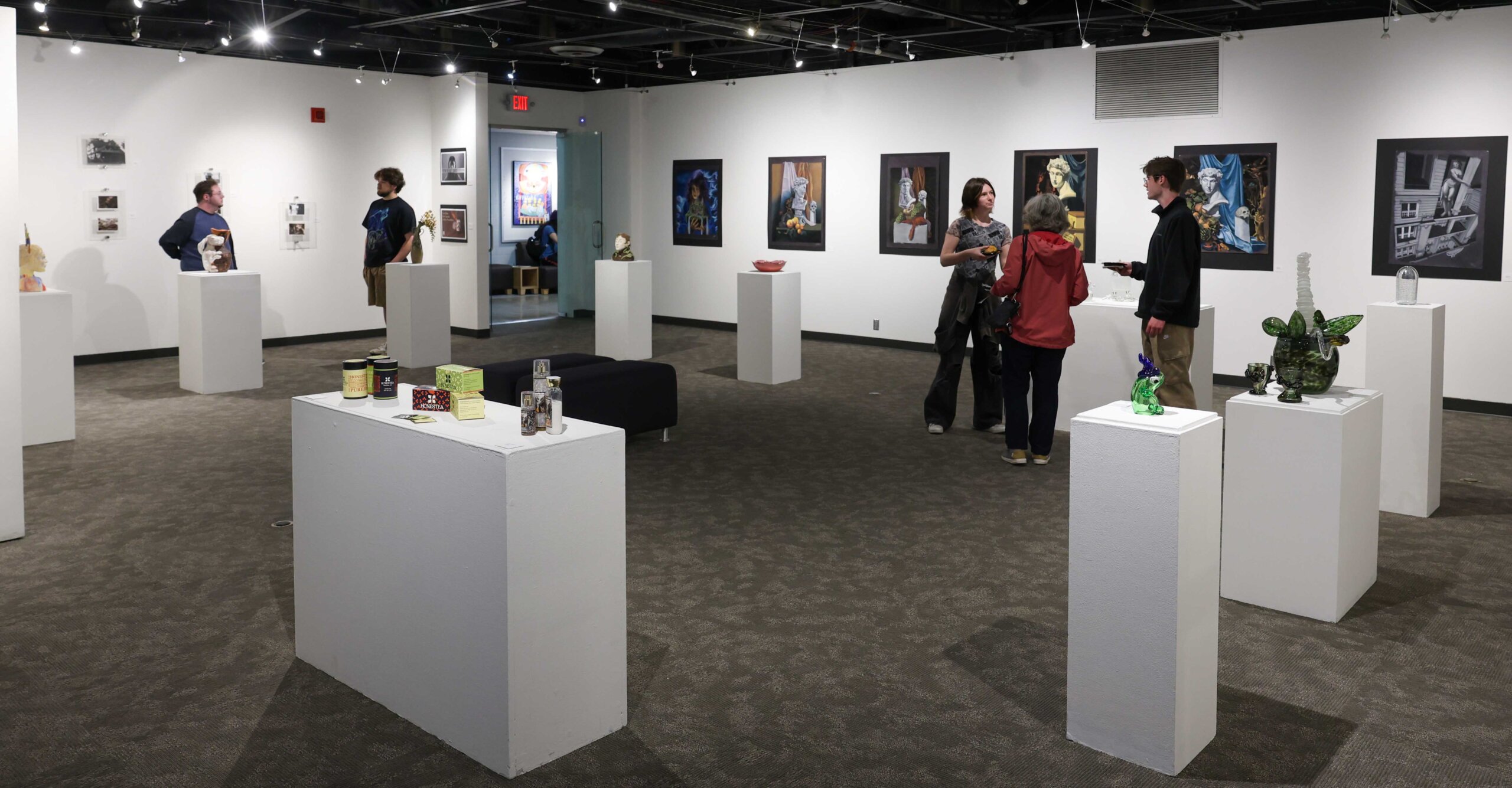 A wide shot of the Faculty Select Exhibit at Walker Art Gallery.