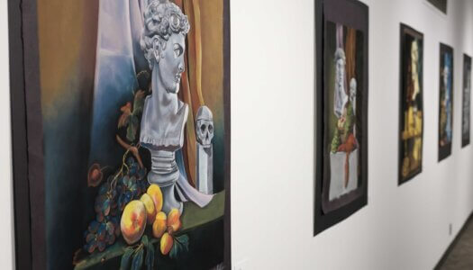 Student paintings are displayed at Walker Art Gallery.