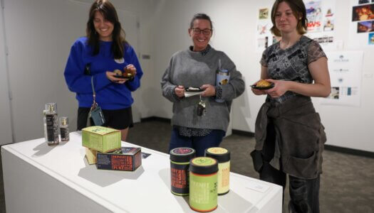 Attendees check out the Faculty Select Exhibit during Thursday's reception.