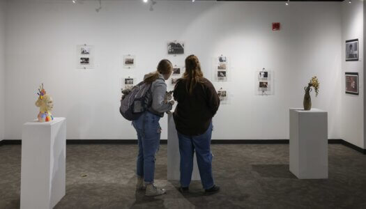 Attendees check out the Faculty Select Exhibit during Thursday's reception.