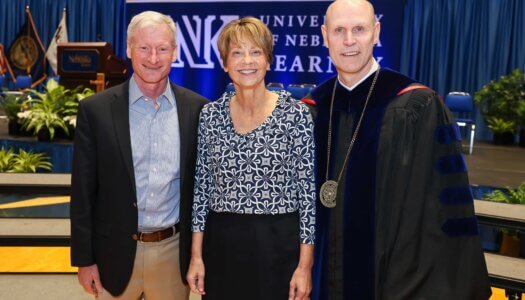 UNK Chancellor Neal Schnoor is pictured with his wife Teresa and a family friend.