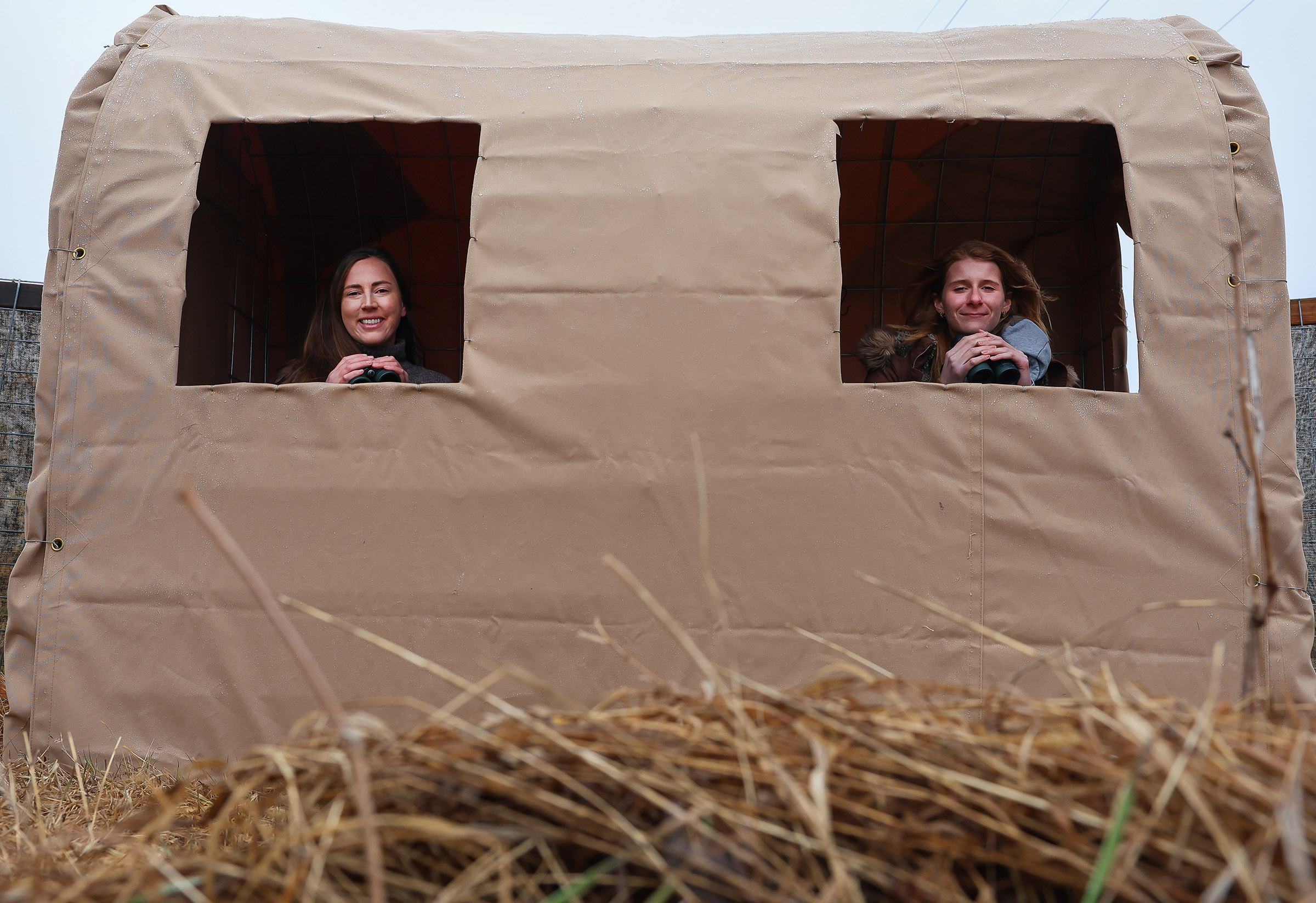 Amanda Hegg and Katie Arens are pictured in an observation blind along the Platte River.