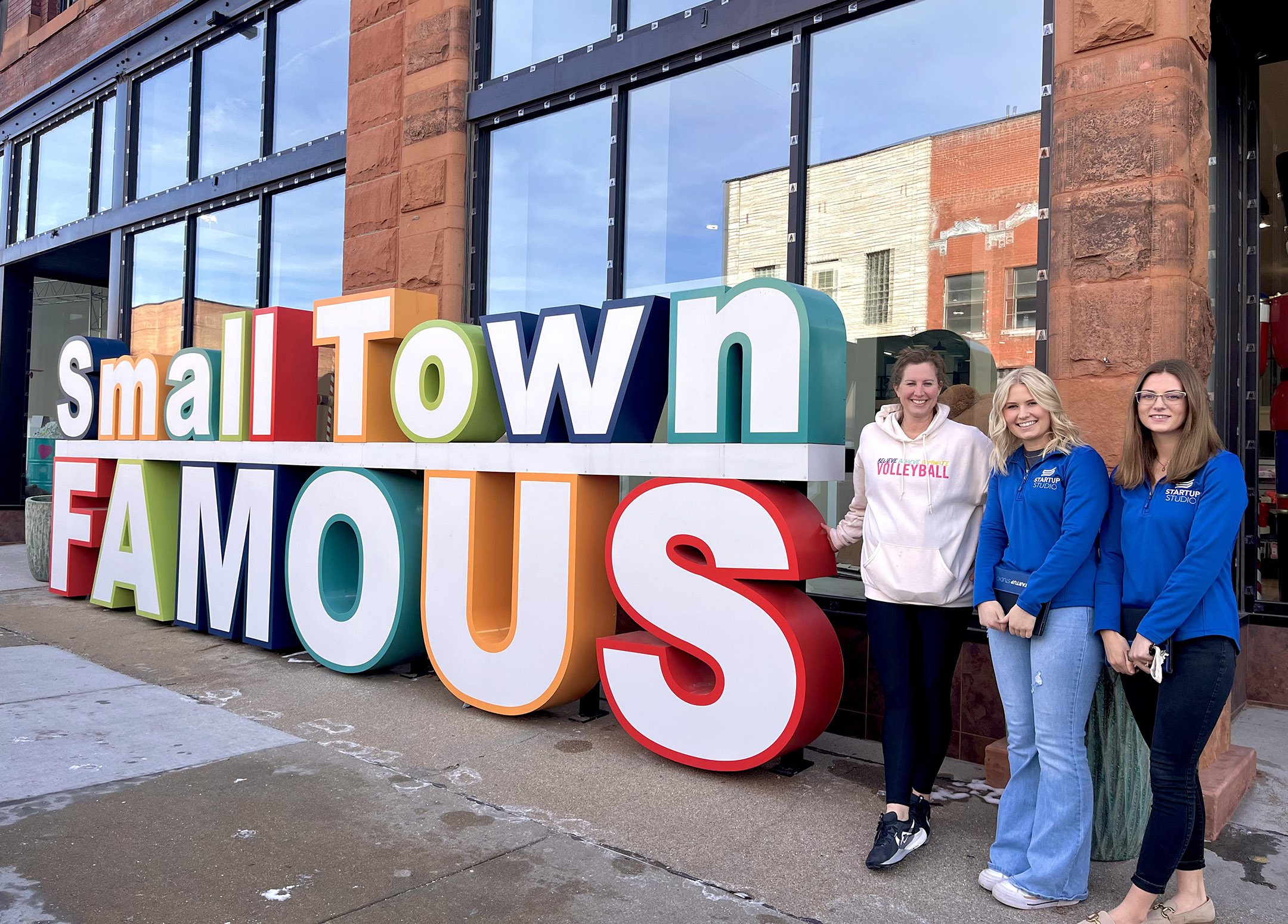 Startup Studio participants Kailynn Rodewald and Fallon Wells are pictured with Small Town Famous owner Jacque Cranson in Hastings.